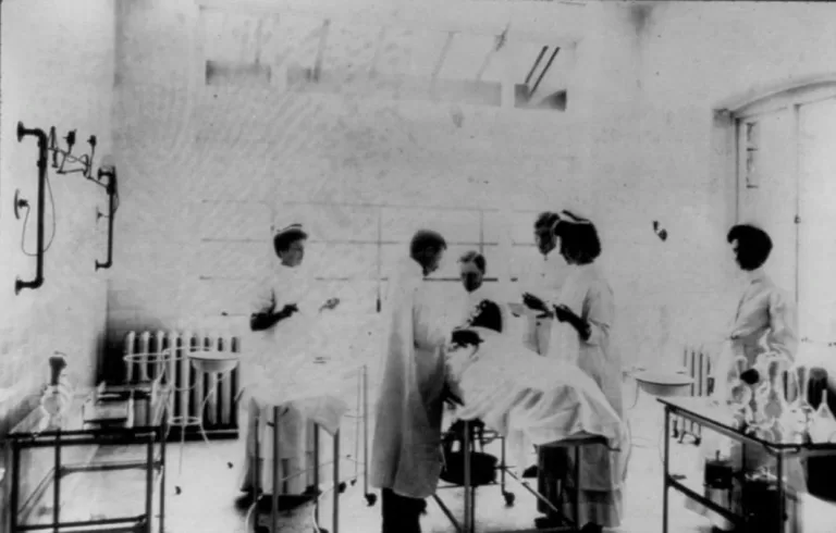 Nurses and doctor conducting an operation in the O.R.